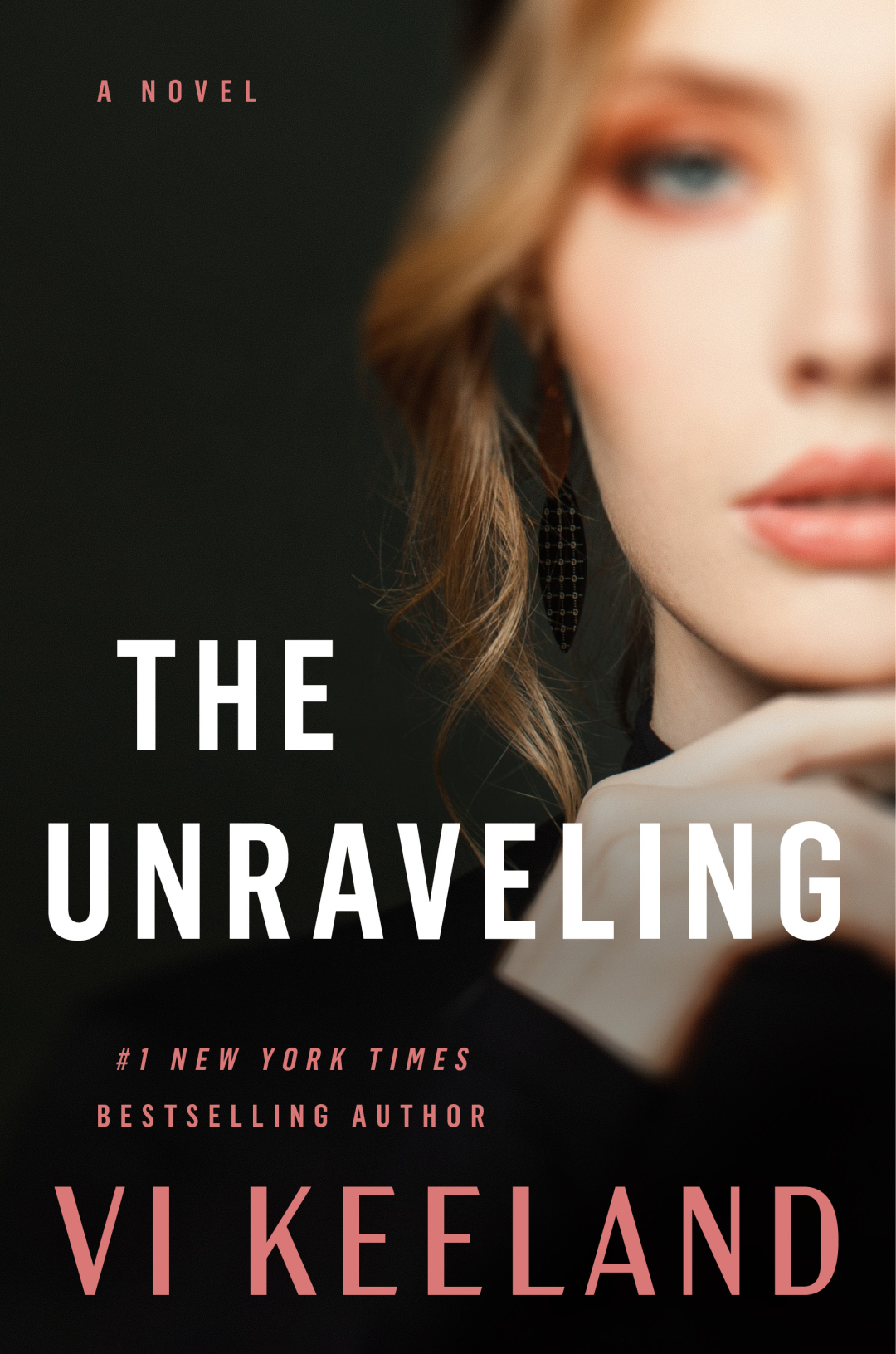 Cover of The Unraveling by Vi Leyland. A solitary woman walks down a dark, rainy street in New York City. The fractured title typography hints at psychological tension and emotional collapse.