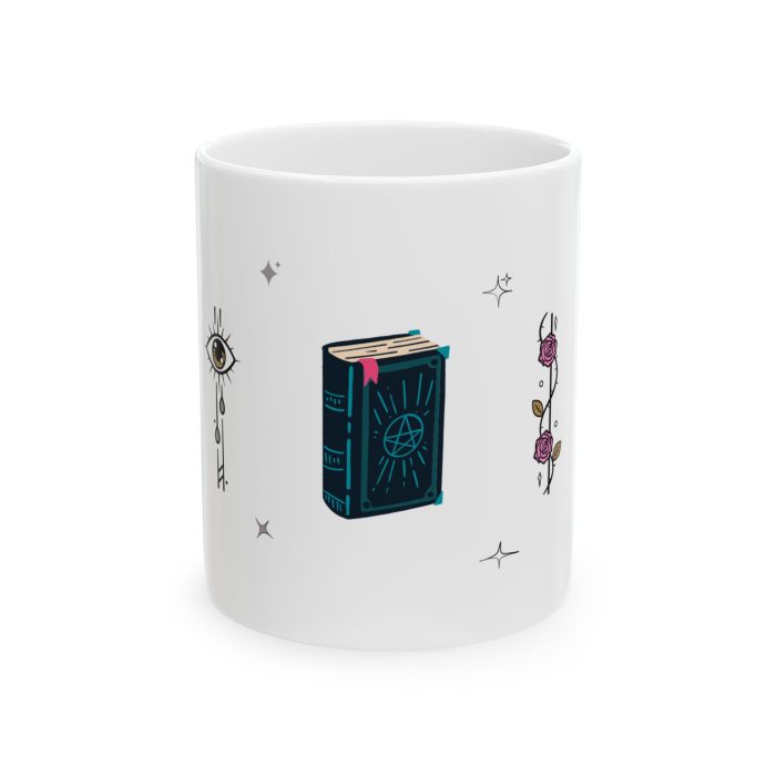 White ceramic mug with mystical illustrations including skulls, roses, a witches’ book, and melting candles.