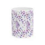 White ceramic mug with multiple purple butterflies surrounding the cup, featuring larger butterflies in the center.