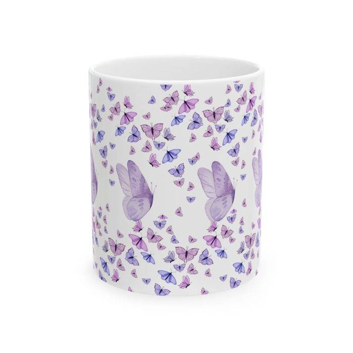 White ceramic mug with multiple purple butterflies surrounding the cup, featuring larger butterflies in the center.